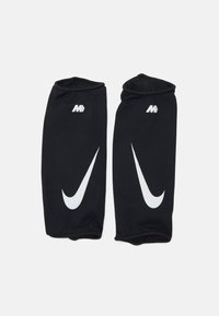 Maniche atletiche nere realizzate in tessuto texturizzato. Presentano un grande logo Nike swoosh bianco e un piccolo logo di accento bianco vicino alla parte superiore.
