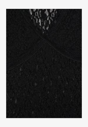 Tissu en dentelle noire avec des motifs floraux et des sections qui se chevauchent formant un détail en croisillon au centre.