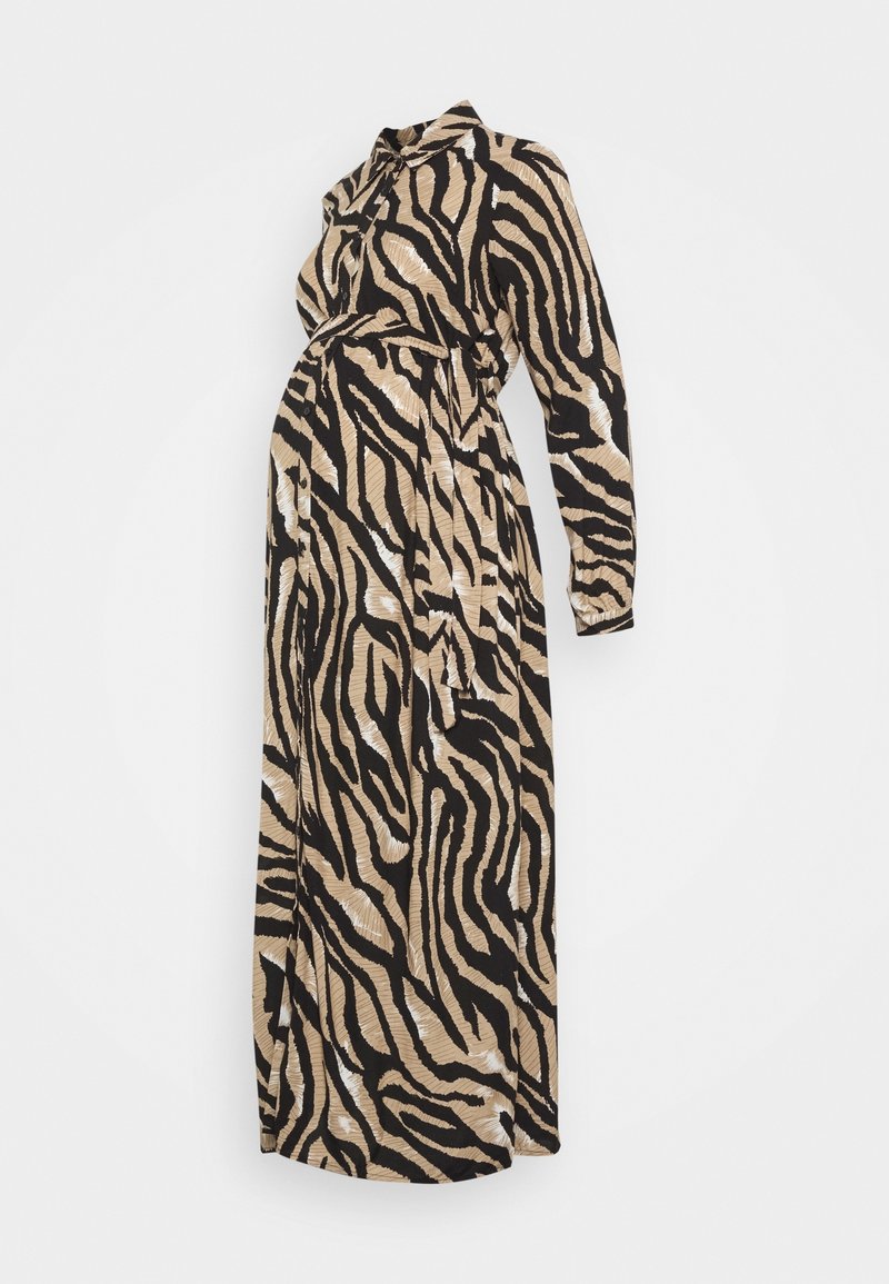 Graviditetstøj med sort og beige tigerstribemønster, lange ærmer, bælte i taljen og en flydende silhuet. Fremstillet af blødt stof.