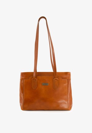Brown leather tote bag with two long handles, polished finish, subtle stitching details, and a metallic brand tag on the front.