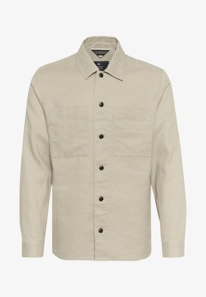 Beige Leinenhemd mit Kragen, Knopfleiste und zwei Brusttaschen. Mit dunklen Knöpfen und langen Ärmeln.