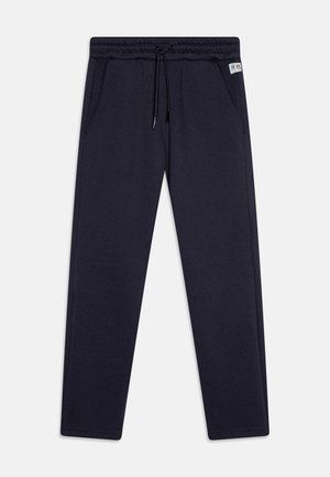 Navy jogger pants made of soft fabric, featuring an elastic waistband with drawstring, side pockets, and ribbed cuffs at the ankles.