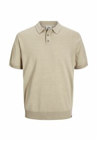 Polo shirt beige à manches courtes en tissu tricoté doux. Présente un col, une patte de boutonnage à deux boutons et un ourlet et des poignets côtelés.