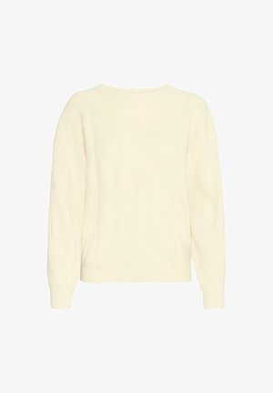 Kreminės spalvos megzta svandsukne su apvaliu iškirpimu, griovelio tekstūra ir deimanto raštais. Turi ilgomis rankovėmis ir prigludusį apatinius kraštus.