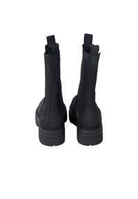 Black ankle boots made of smooth leather with elastic side panels, rounded toe, and textured rubber sole. Boot shaft reaches mid-calf height.