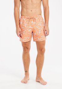 Oranje zwembroek met een wit bladerenpatroon, elastische tailleband met een trekkoord, knielang en een gladde stoftextuur.