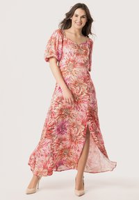 Robe maxi en imprimé floral avec des nuances de rose, orange et violet. Manches courtes bouffantes, décolleté en V et fente haute sur la cuisse. Tissu lisse.