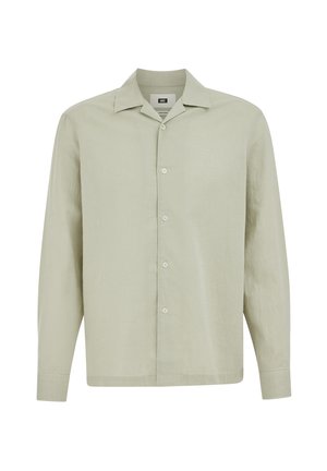 Chemise beige à manches longues avec col classique, boutons visibles sur le devant et ourlet droit.