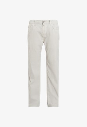 Jasne beżowe spodnie z korduru o prostym kroju nogawek, z suwakiem i guzikiem, dwoma przednimi kieszeniami oraz delikatnymi pionowymi paskami.