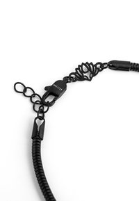 Black chain necklace featuring a lotus ornament, a lobster clasp, and textured links, highlighting a sleek design and smooth finish.