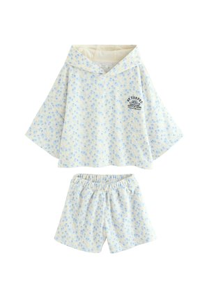 Helles cremefarbenes Kapuzenshirt und Shorts mit elastischem Bund, mit kleinem blauem Blumenmuster und schwarzem St Tropez-Schriftzug auf der oberen linken Brust.