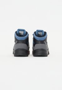 Black and gray hiking shoes with blue accents, featuring a padded collar, textured surface, and rubber soles. Rear view, laces visible.