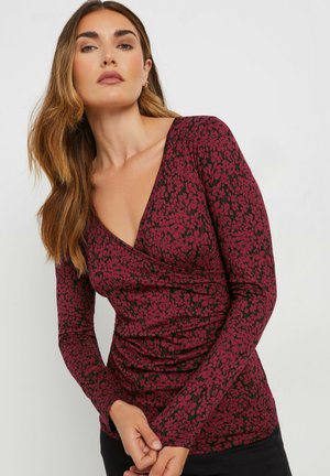 Langärmliges Oberteil mit tiefem V-Ausschnitt in Dunkelrot mit schwarzem Blumenmuster. Verfügt über ein figurnahes Design mit strukturiertem Stoff und gerafften Akzenten.