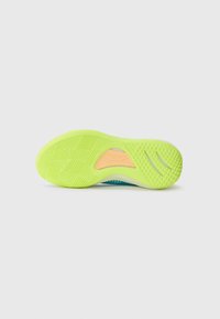 Shoe outsole in bright yellow with a textured grip pattern, featuring a blue accent section and an orange part near the arch for support.