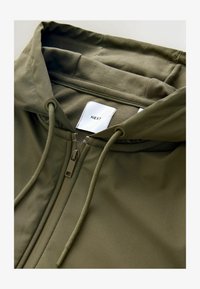 Atlasīts, khaki green