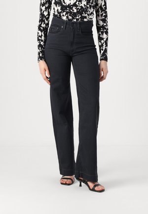 High-waisted black jeans with a straight leg design, made from denim. Features subtle stitching and a classic five-pocket layout.