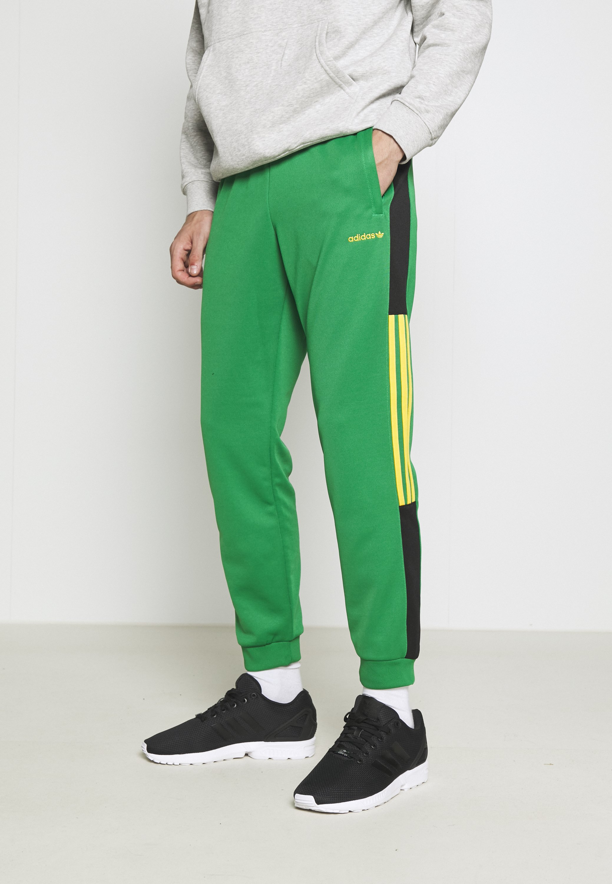 green adidas tracksuit bottoms