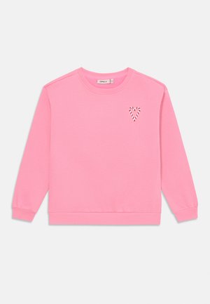 Roza srajca s dolgimi rokavi, z rebrastimi manšetami in robom, ki ima majhen črtast srčni detajl na levi prsni strani. Mehka tekstura tkanine.