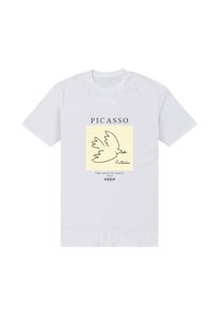 Bílé bavlněné tričko s potiskem holubice na žlutém pozadí, s nápisy "PICASSO", "HOLUBICE MÍRU" a "1999 A.P.O.H."