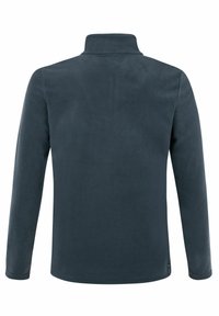 Tamsiai pilka flisinė striukė su aukštu apykakle, ilgomis rankovėmis ir lygiu paviršiumi. Yra tiesus apvadas ir minimalūs aksesuarai.