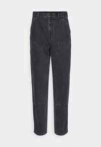 Black denim pants with a high-waisted design, featuring two large patch pockets, contrast stitching, and a tapered leg.