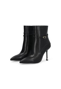 Black leather ankle boots with a pointed toe, slim stiletto heel, and a side zipper. Features a thin strap with a small metal accent.