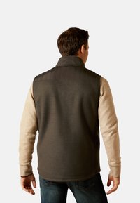 Fleece-Weste mit gepolstertem Kragen in Dunkelgrau und hellgrauen Ärmeln. Mit gerippten Bündchen und geradem Schnitt, ideal zum Schichten.