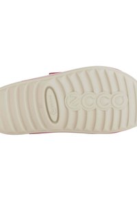Sole of Ecco shoe, beige rubber with horizontal ridges, features the brand logo and model name. Pink accent along the edge.