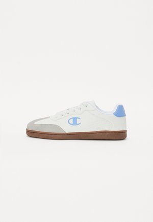 White and grey sneaker with a light blue accent, featuring laces, a textured surface, and a brown rubber sole. Logo on side.
