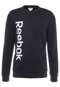 Sudadera negra de manga larga hecha de una mezcla de algodón, con el logo blanco de "Reebok" en vertical en el lado izquierdo. Cuello redondo y puños de canalé.