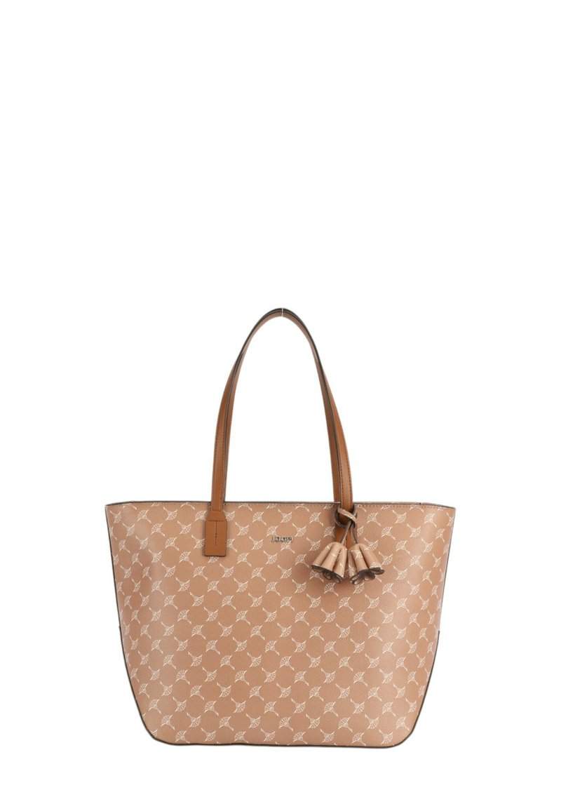 Sac fourre-tout beige avec un motif de feuilles blanches répétées, anses en cuir marron et un pompon décoratif. Présente une texture lisse et une forme structurée.