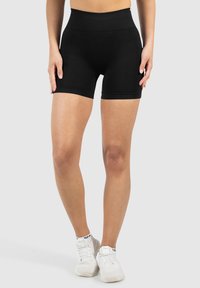 Zwarte stretchshorts met een brede tailleband, een gladde textuur en een aansluitend ontwerp. Heeft een lengte tot halverwege de dij en zonder zichtbare patronen of hardware.