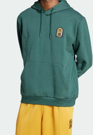 Green hoodie made of cotton blend, featuring a front pocket and drawstring hood. Includes a yellow and navy logo patch on the chest.