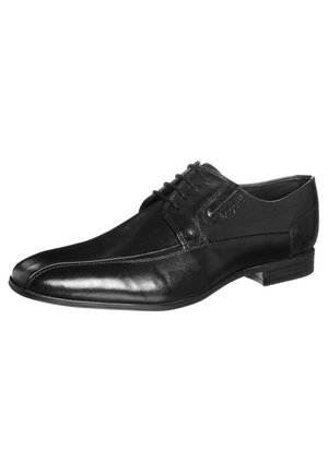 Chaussure habillée en cuir noir pour homme avec lacets à l'avant, bout pointu et petit talon, présentée sur fond blanc.