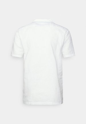 Short-sleeve white shirt made of linen with a flat collar, visible stitching, and a straight cut, shown from the back.