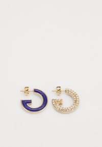 Gold-tone earrings featuring one blue enamel half hoop and one embellished with clear rhinestones on a curved design.