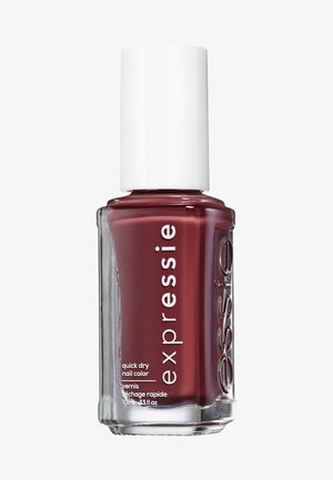 Red nail polish in a glass bottle with white cap. Label shows "expressie quick dry nail color," 10ml size. Smooth texture, glossy finish.