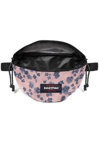 Kulaté pouzdro Eastpak v růžové tkanině s tmavým květinovým vzorem, černým zipem a vnitřní podšívkou. Má nastavitelný šňůrkový uzávěr.