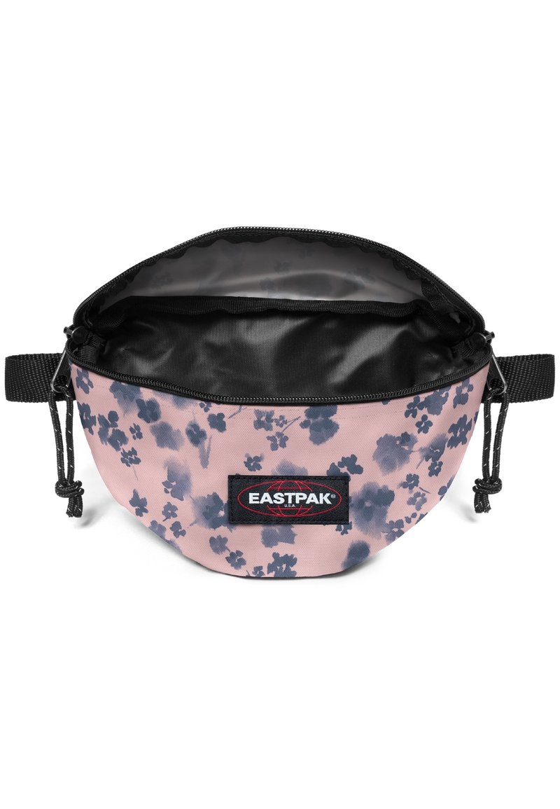 Kulaté pouzdro Eastpak v růžové tkanině s tmavým květinovým vzorem, černým zipem a vnitřní podšívkou. Má nastavitelný šňůrkový uzávěr.