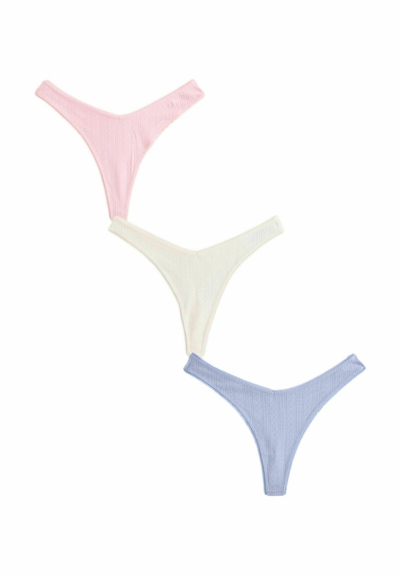 Three pairs of ribbed cotton thongs in pink, white, and light blue, featuring a low-rise design with textured fabric and delicate stitching.