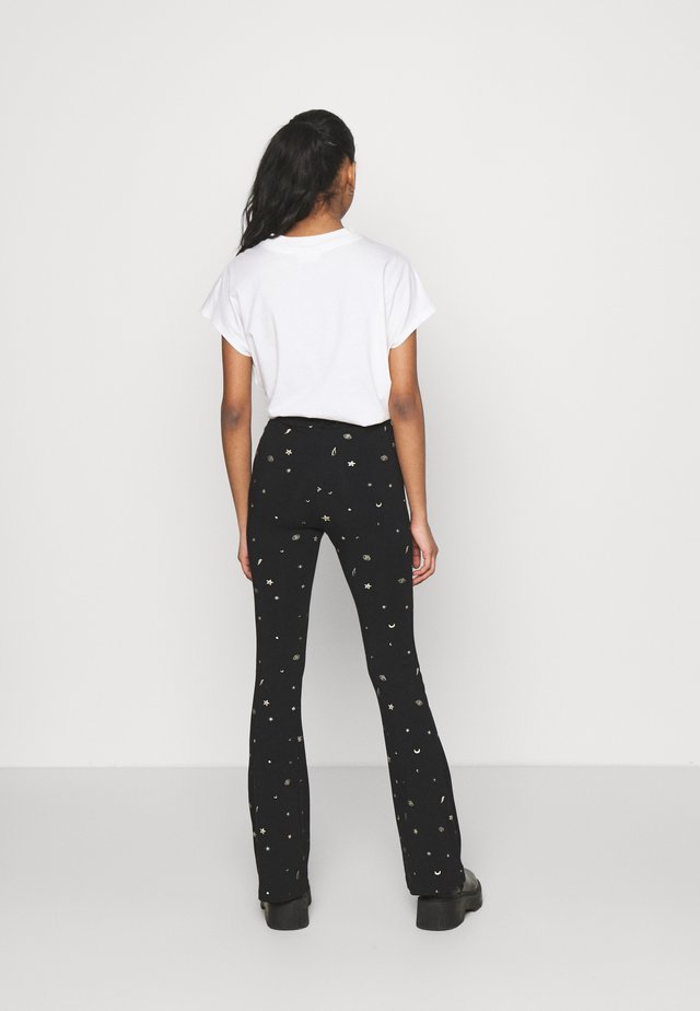 STAR EYE PRINT BASIC FLARE PANTS - Broek - black