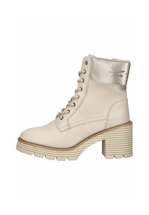 Bottine beige à talon épais, lacets sur l’avant, col rembourré et semelle texturée pour une bonne adhérence.