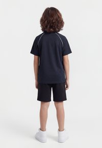 Karl Kani - T-shirt z nadrukiem