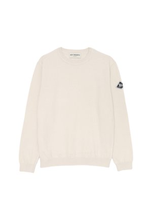 Maglione a maglia di colore crema con scollatura rotonda, maniche lunghe, polsini a coste e una piccola etichetta con logo sulla manica sinistra. Texture morbida.