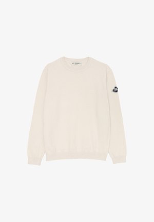 Maglione a maglia di colore crema con scollatura rotonda, maniche lunghe, polsini a coste e una piccola etichetta con logo sulla manica sinistra. Texture morbida.