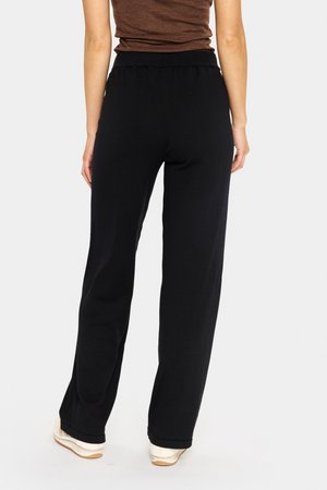 Sorte, løstsiddende sweatpants med elastisk talje, lavet af blødt materiale, med lige ben og ingen synlige lommer.