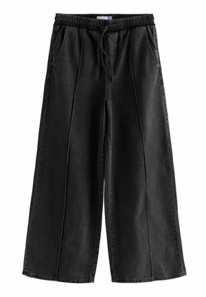 Wide-leg black denim pants with an elastic waistband, drawstring, and side pockets. Features a smooth texture and subtle stitching details.