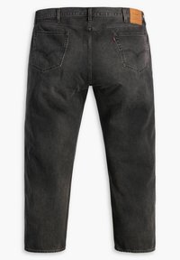 Svarta denimjeans med rak benpassform, med två bakfickor och en läderlogotyp på midjan. Strukturerat tyg.