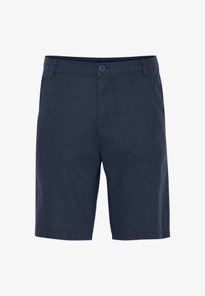 Lippu siniset pellavashortsit nappikiinnityksellä, tasaisella edellä ja suorella leikkauksella. Ominaisuuksiin kuuluvat kylk pockets ja kääntöhelma.