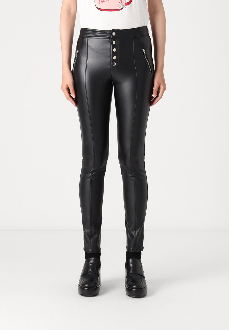 Black faux leather high-waisted pants featuring a five-button front closure, zippered pockets, and vertical stitching details.
